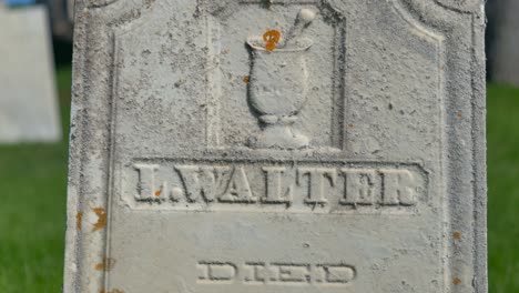 super close up of the grave of the money digger from the 1800s named luman walters who is tied to some of the money digging stories of joseph smith jr