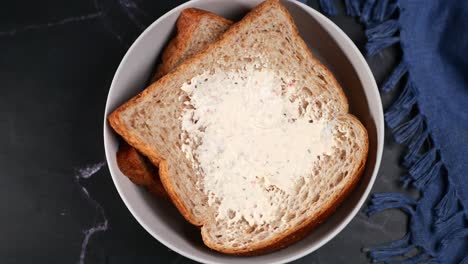 Fresh-butter-spreading-on-a-bread-,