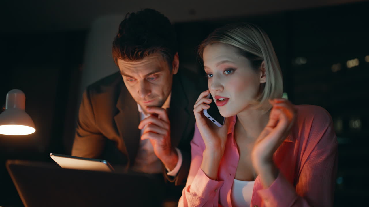 Business Professionals Working Late in the Office