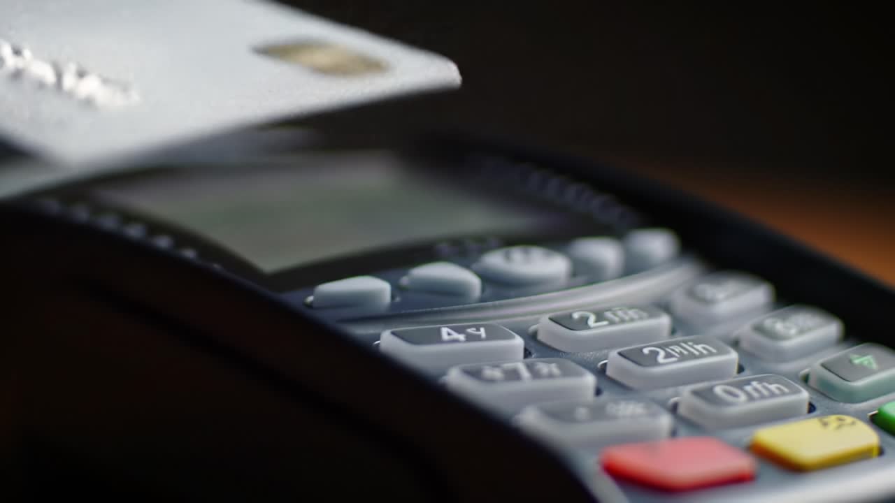 Close-Up of a Payment Terminal Featuring Numeric Keypad and Display, Illustrating Modern Transaction Technology and Point of Sale Interactions in Retail Environments