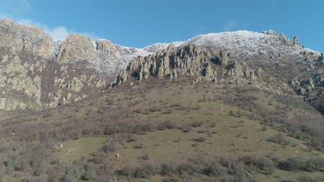 snowy mountain peaks and rocky landscape