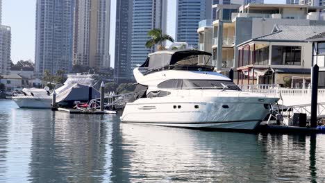 a yacht docked near waterfront buildings