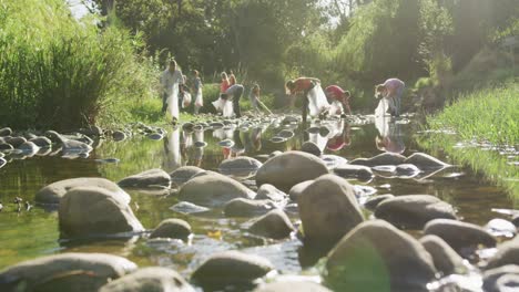 mid adults volunteering during river clean-up day