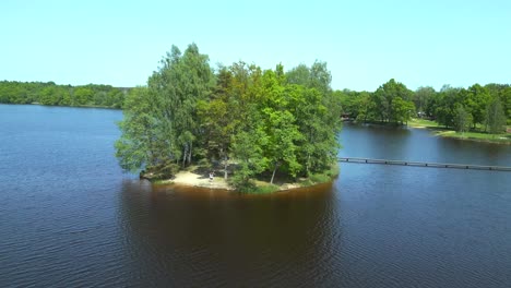 Smooth-aerial-top-view-flight-Natural-Summer-Paradise-idyllic-Island-in-Lake,-Chlum-in-Czech,-day-2023