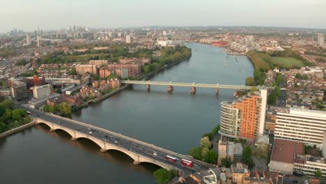 aerial shot over putney bridge with london skyline in the background