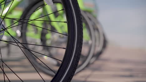 Rental-Bikes-in-a-Line-on-a-Street-in-a-Busy-Urban-Metropolitan