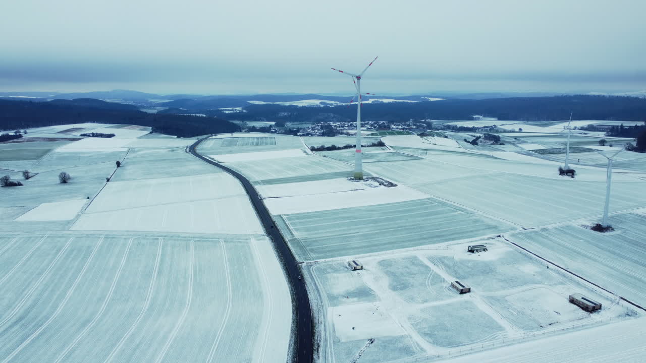 Snowy Winter Landscape with Wind Farm