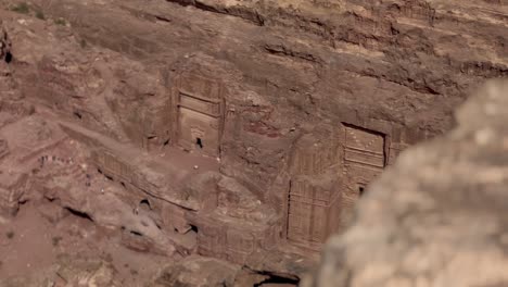 Looking-over-a-cliff-at-the-tombs-at-Petra-Jordan