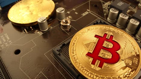 gold bit coin btc coins on the motherboard. bitcoin is a worldwide cryptocurrency and digital payment system called the first decentralized digital currency.