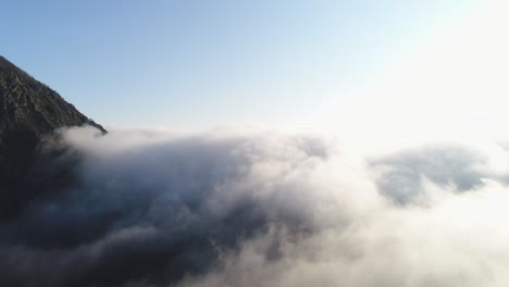 mountain peaks above the clouds