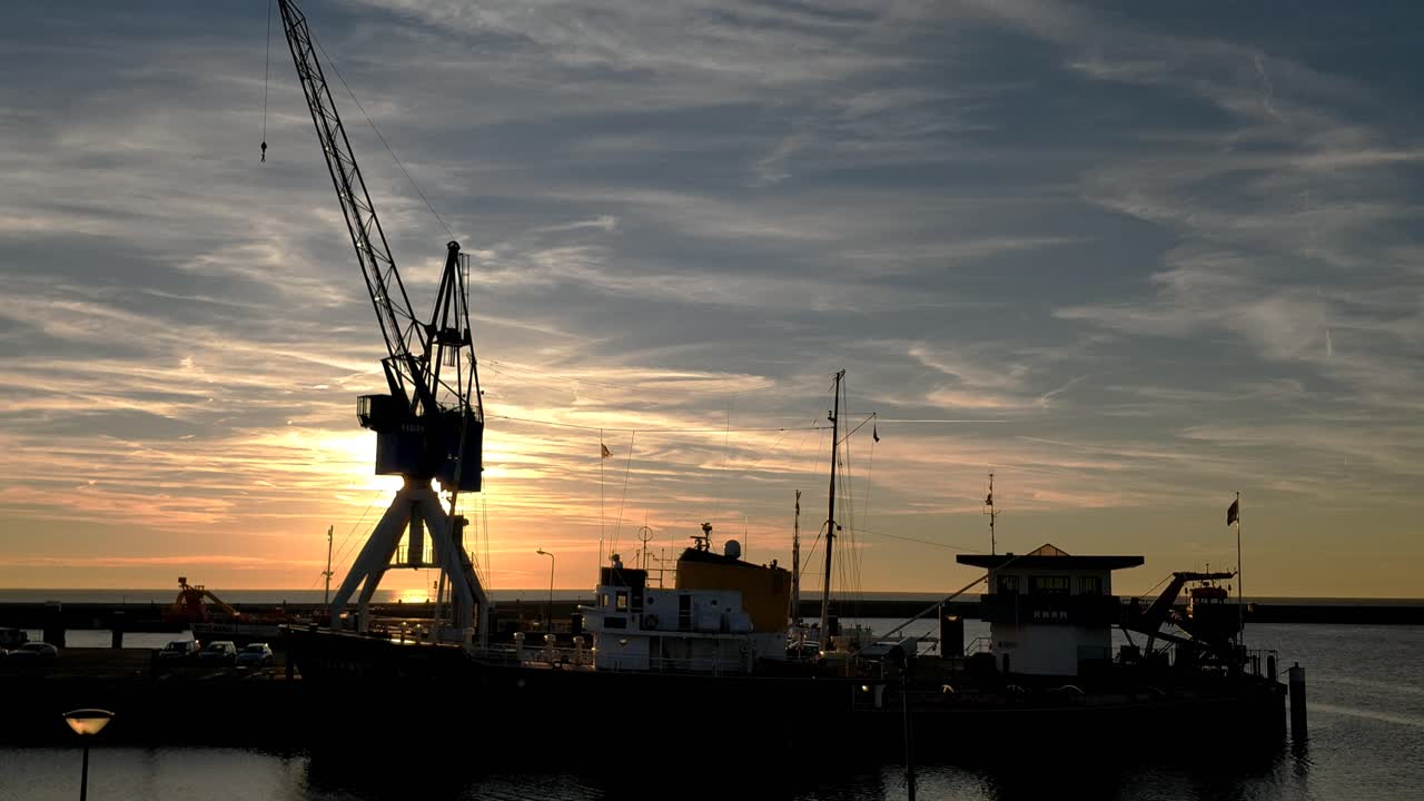 Steady shot of a sun set in the harbour of Harlingen