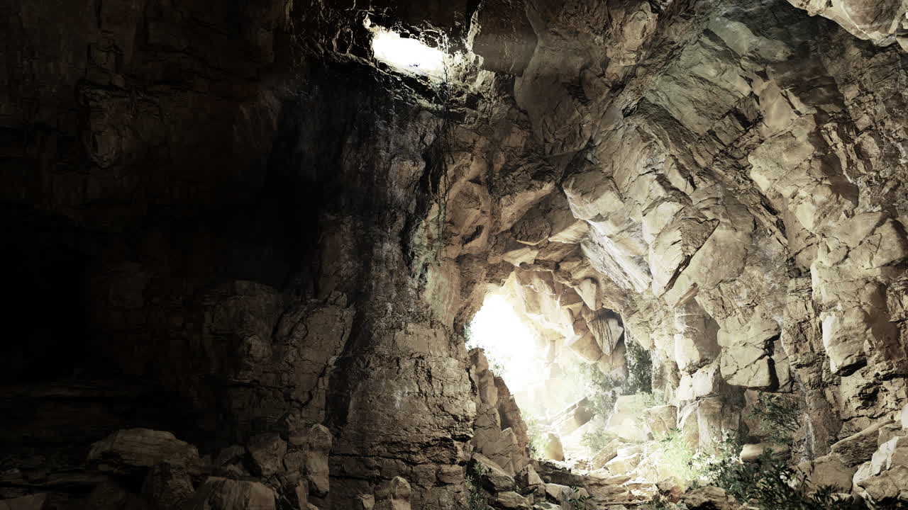 Exploring rocky cave formations with natural light shining through