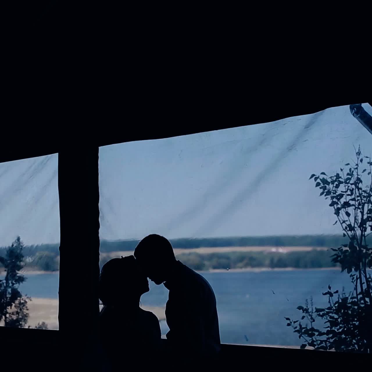 Silhouette of wedding kiss