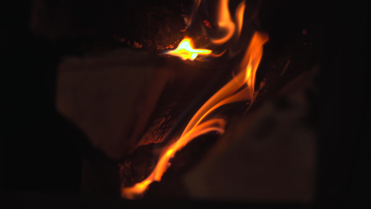 Flame Trail Sweeping Across Burning Log, Slender Orange Streaks And Curling Smoke, Dramatic Motion Closeup. Media