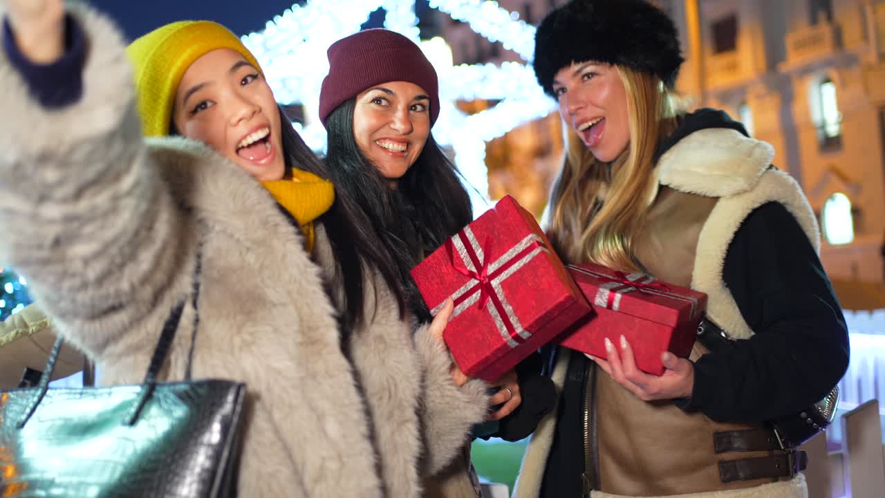 Friends taking selfies with gifts at night