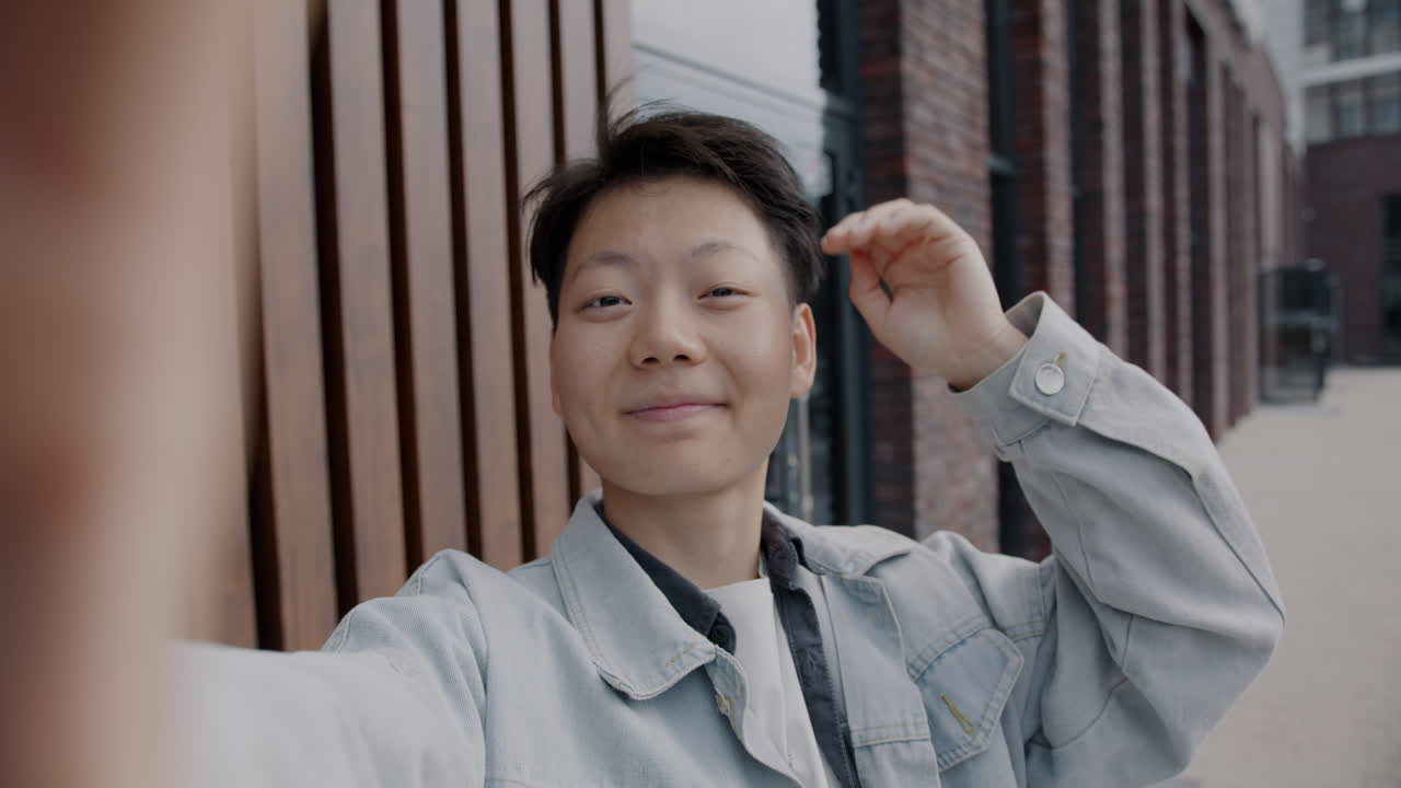 Smiling Person Taking Selfie Outdoors