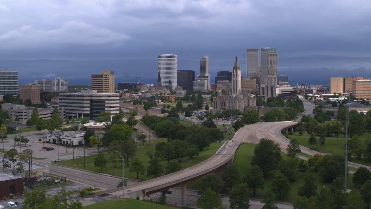 Drone view of Tulsa, Oklahoma downtown cityscape area with distant landscape