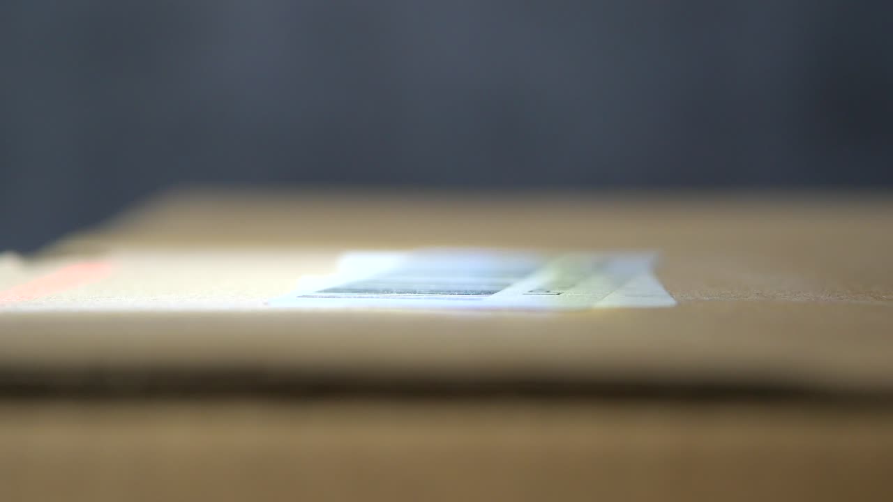 Close-up of a cardboard box with a barcode label