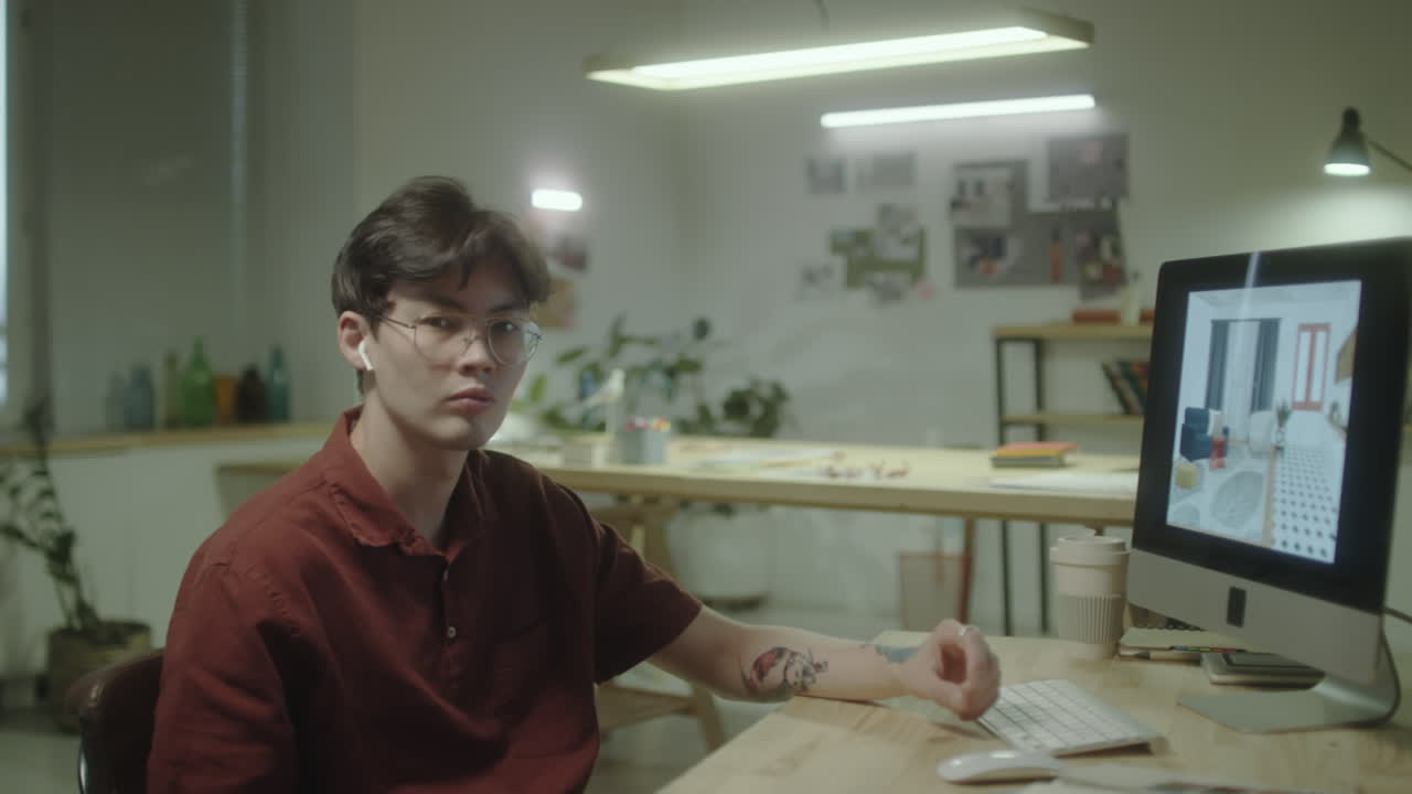 Young Man Working on Interior Design Project on Computer