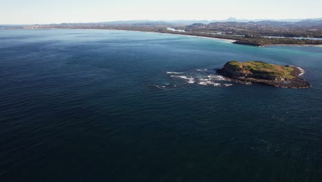 cook island and seascape in nsw, australia - aerial shot
