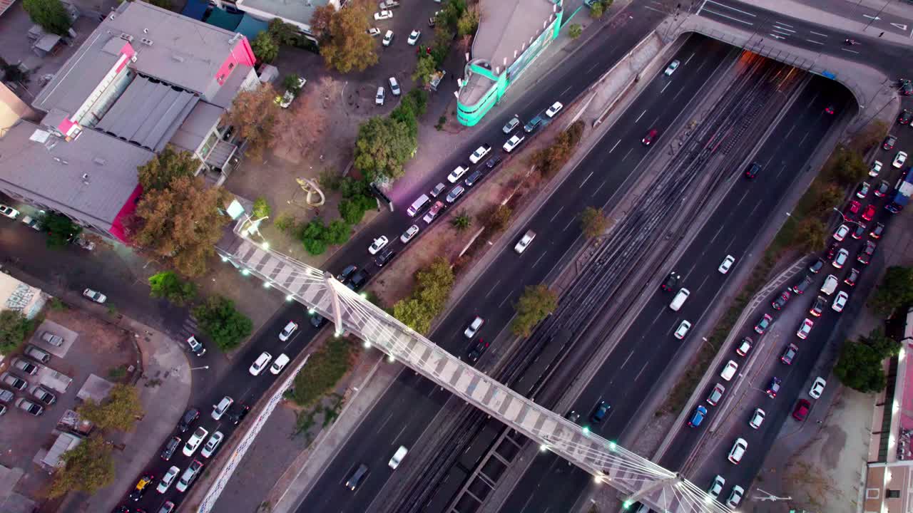 Aerial view looking down over Hu&eacute;rfanos footbridge busy Santiago traffic highway, Chile cityscape