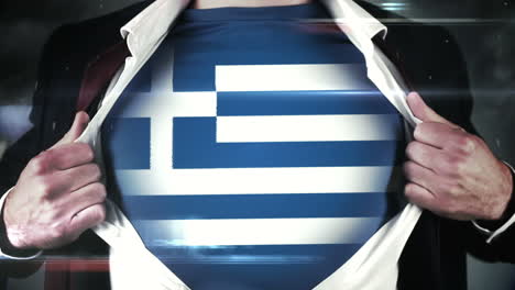 businessman opening shirt to reveal greek flag