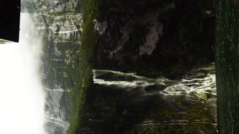 Waterfalls-forming-everywhere-during-rain-season-in-Milford-Sound,-vertical-view