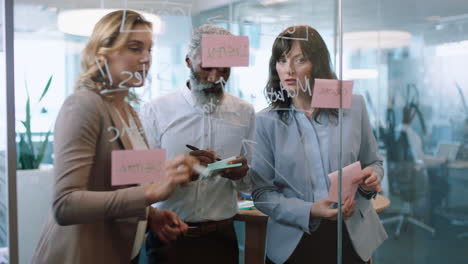 business people using sticky notes brainstorming team leader woman working with colleagues writing on glass whiteboard showing problem solving strategy in office meeting