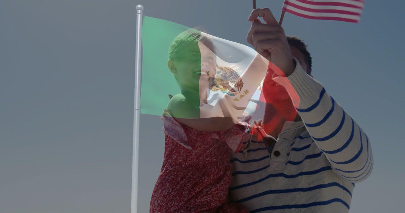 Father lifting daughter reaching American flags while Mexican flag overlay drifting for marketing