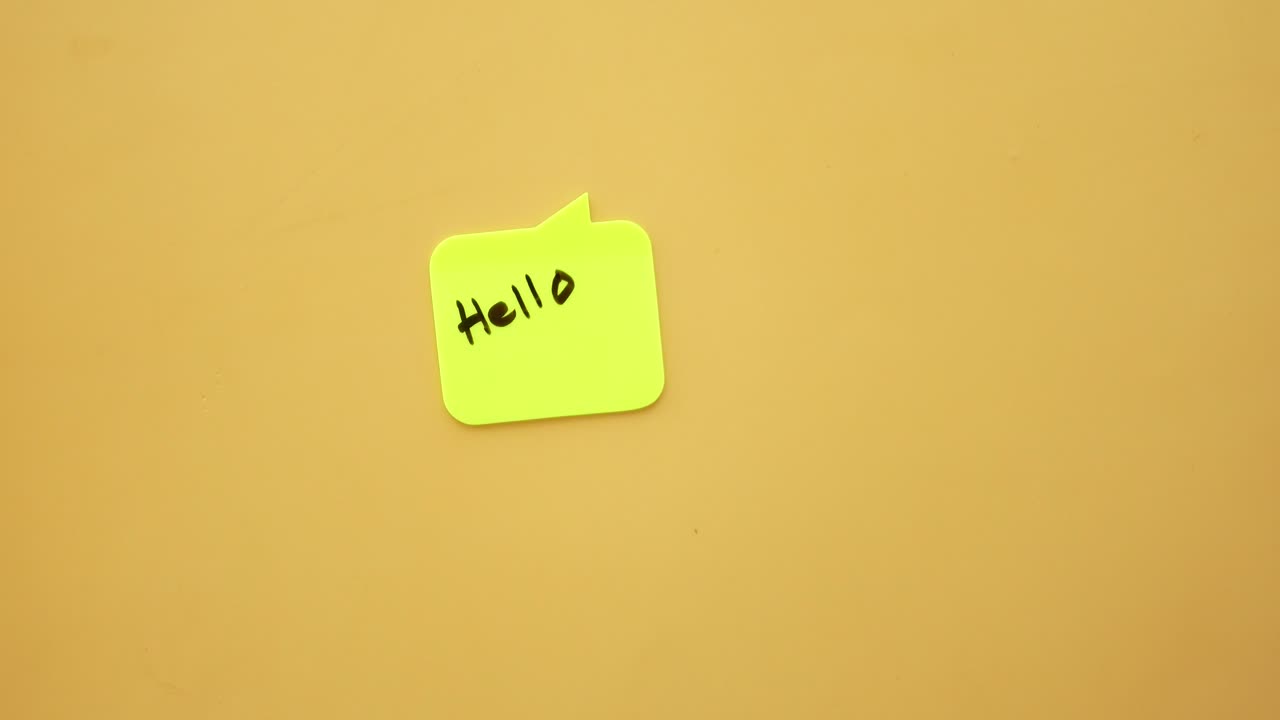 Writing 'Hello' on a note