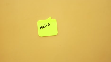 writing 'hello' on a note