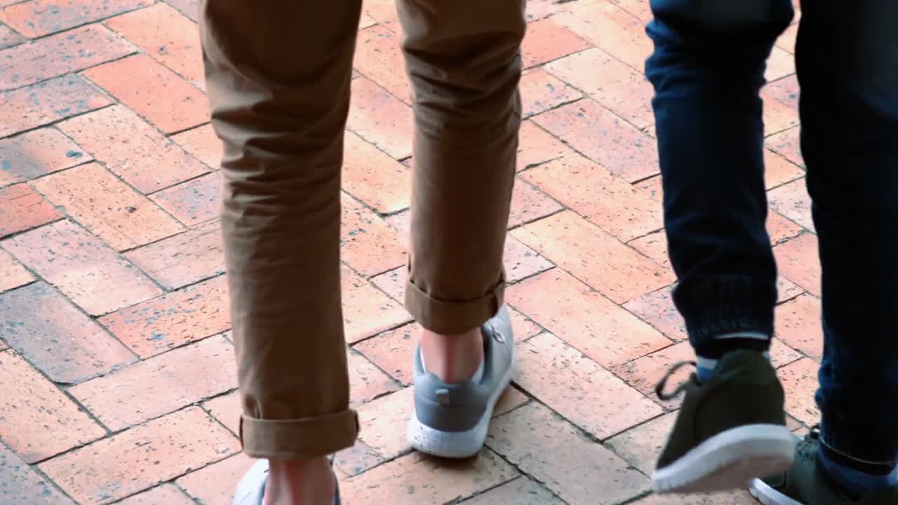 School kids walking in corridor at school