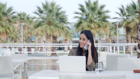 young woman sitting on an outdoor patio