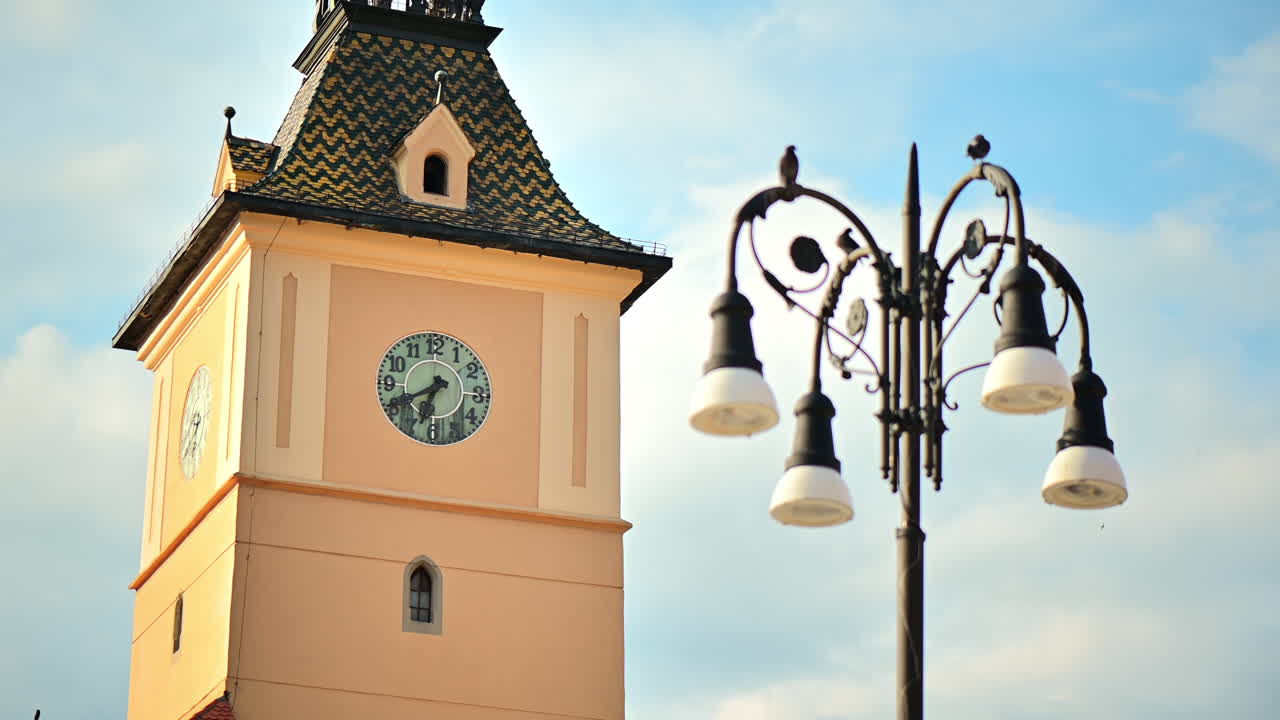 Close view of the County Museum of History and a lamp post in old Brasov centre, Romania