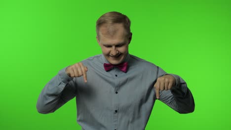 man asking to subscribe, trying to control, pointing fingers down. guy on chroma key background