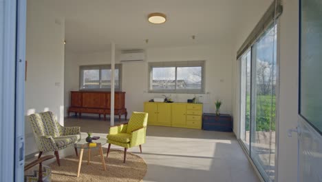 an interior shot of a nice clinic reception room, with a big window showing green grass and blue skies in the countryside2