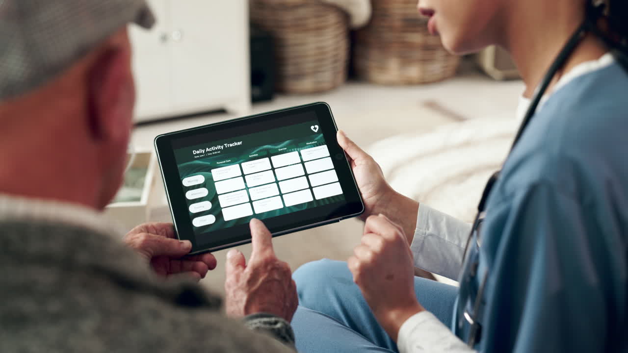 Elderly man using a tablet with a nurse for healthcare