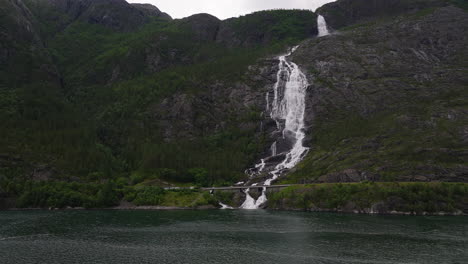 motion and noise of white water cascading down mountainside, aerial