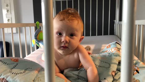 cute-baby-girl-laying-and-playing-in-her-bed