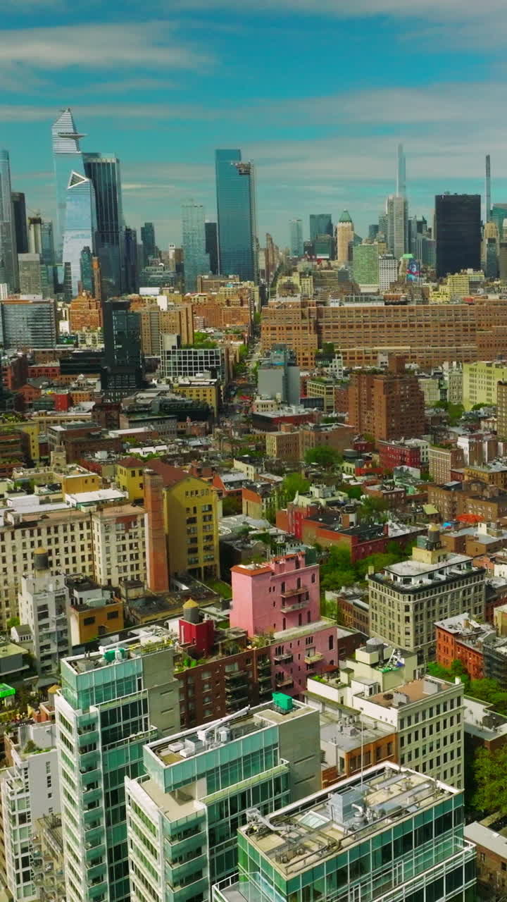 Sunny New York quarters with diverse architecture. Aerial view of metropolis with skyscrapers at backdrop. Vertical video