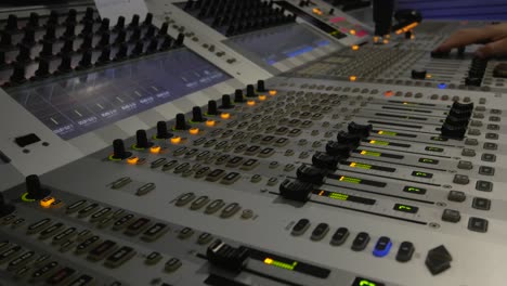 broadcast audio mixer, man hand working on it - portugal