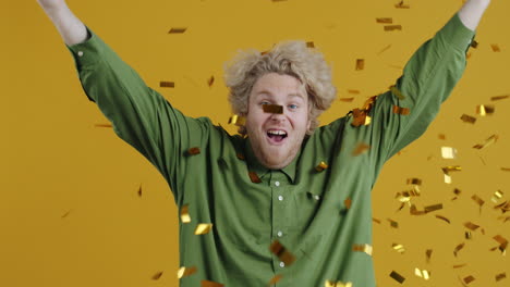 man celebrating with confetti