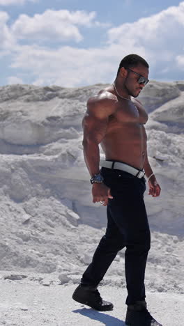 beauty and perfection of human body. muscular black african man body topless outdoor. vertical video