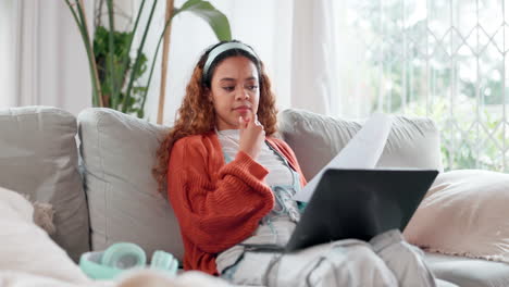 woman working from home on a sofa