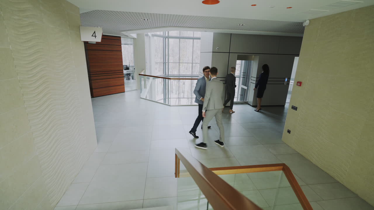 Business People Walking in Modern Office Corridor
