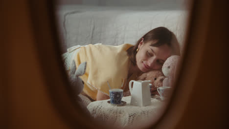 a girl playing with dolls in her room