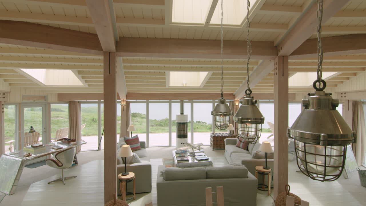 Industrial pendant lights in spacious modern home with timber interior design