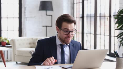 Overjoyed businessman executive celebrates online project business success