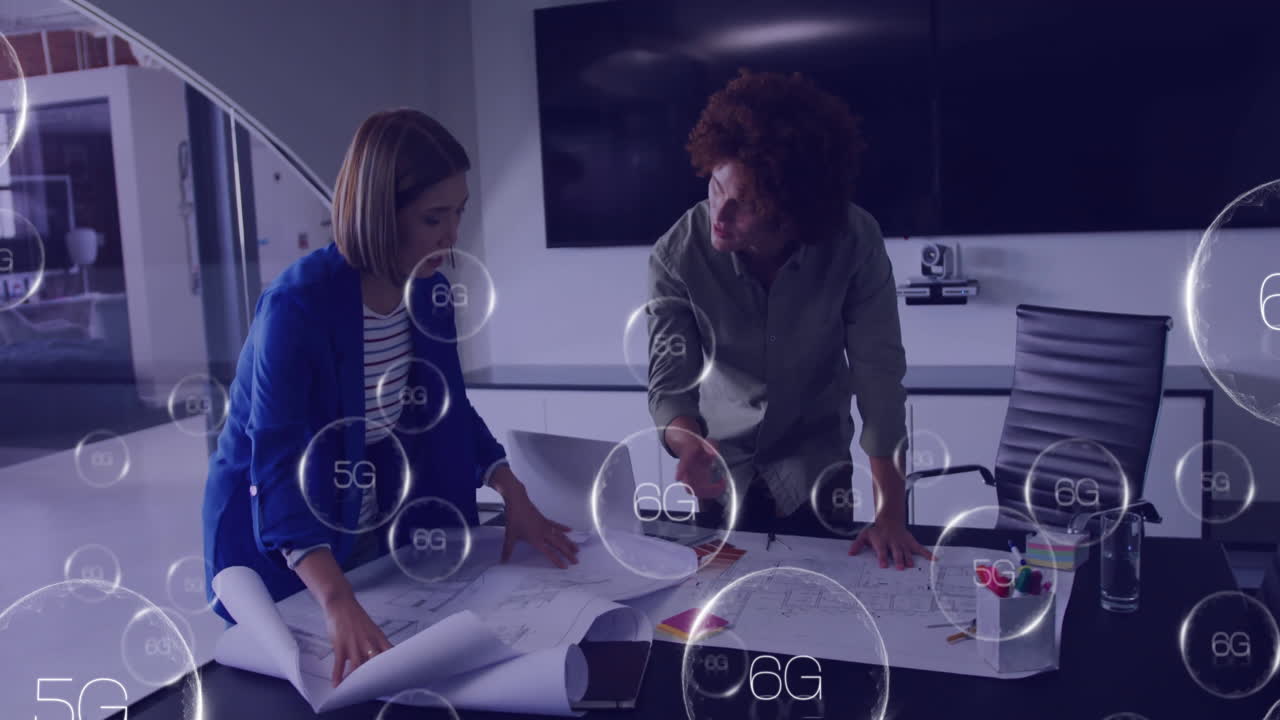 Animation of 6g text over diverse colleagues discussing work in office