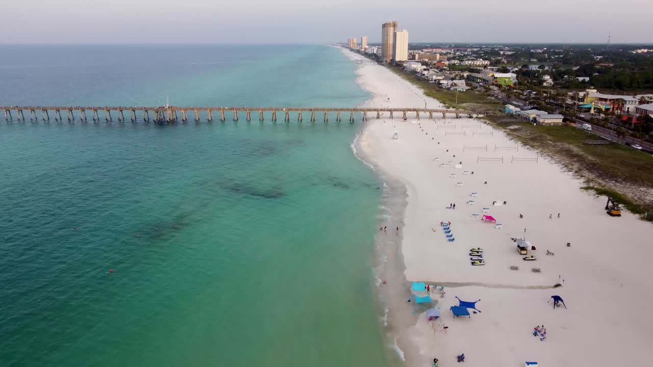 Panama city beach fishing pier and beach aerial coastal view with empty beach on early morning